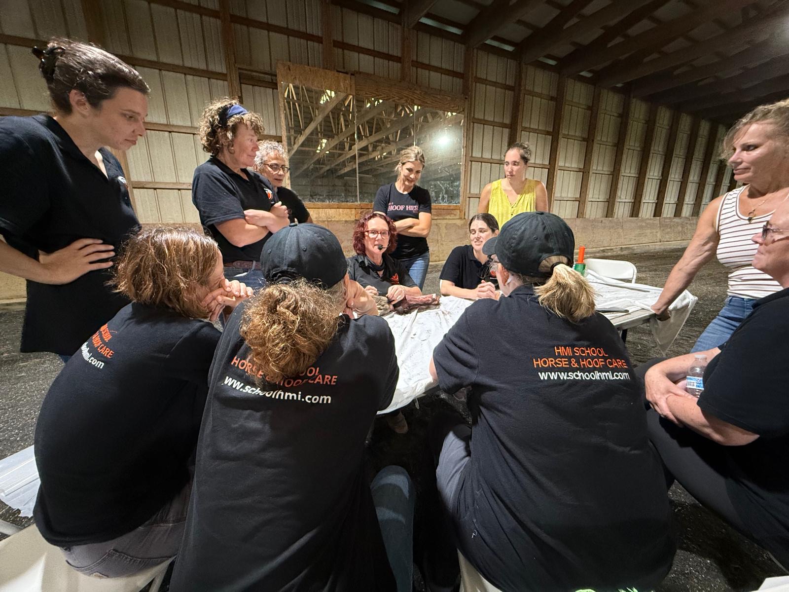 HMB Pro students learning together around a teaching table